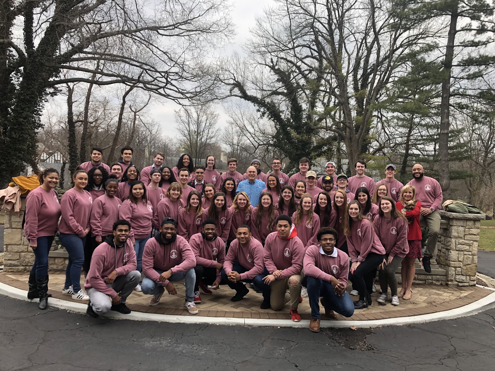 A large group of fraternity and sorority members posing for a photo